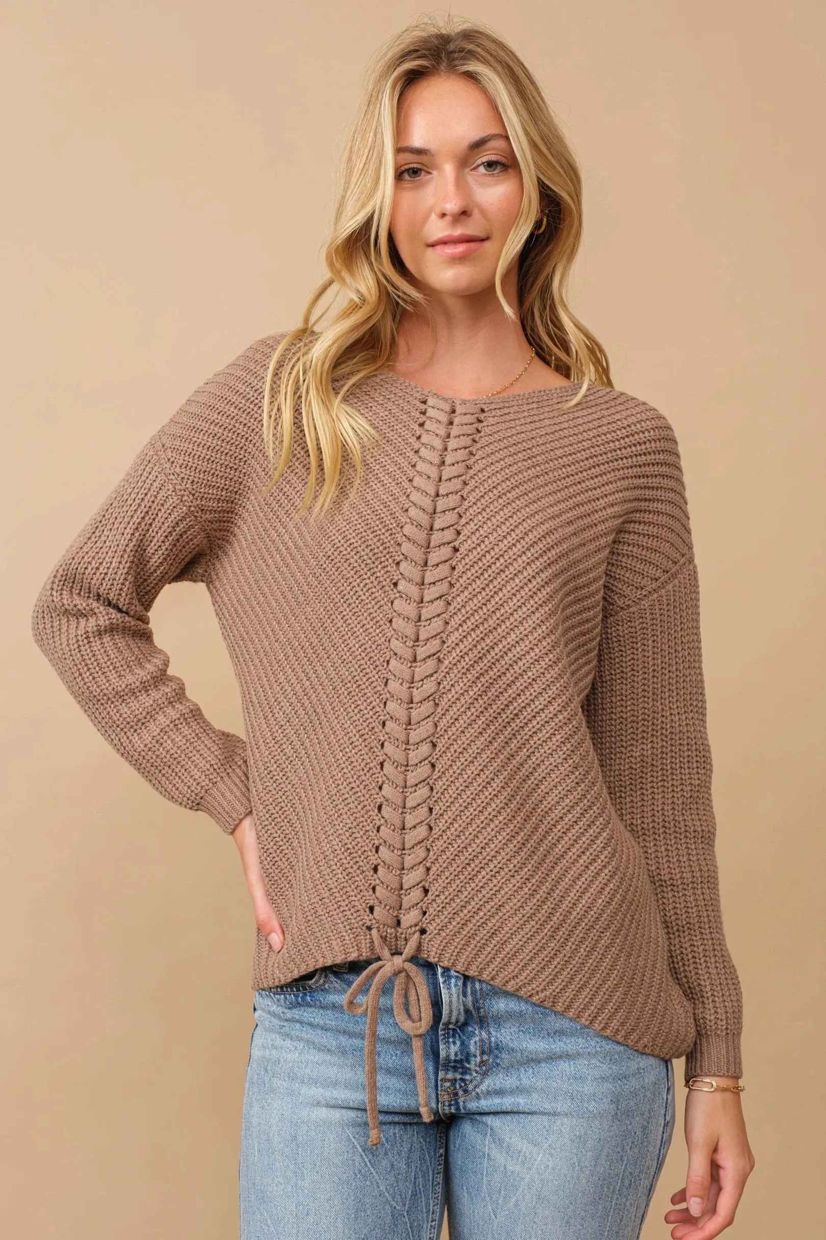 Ribbed knit round neck sweater with center lace-up detail