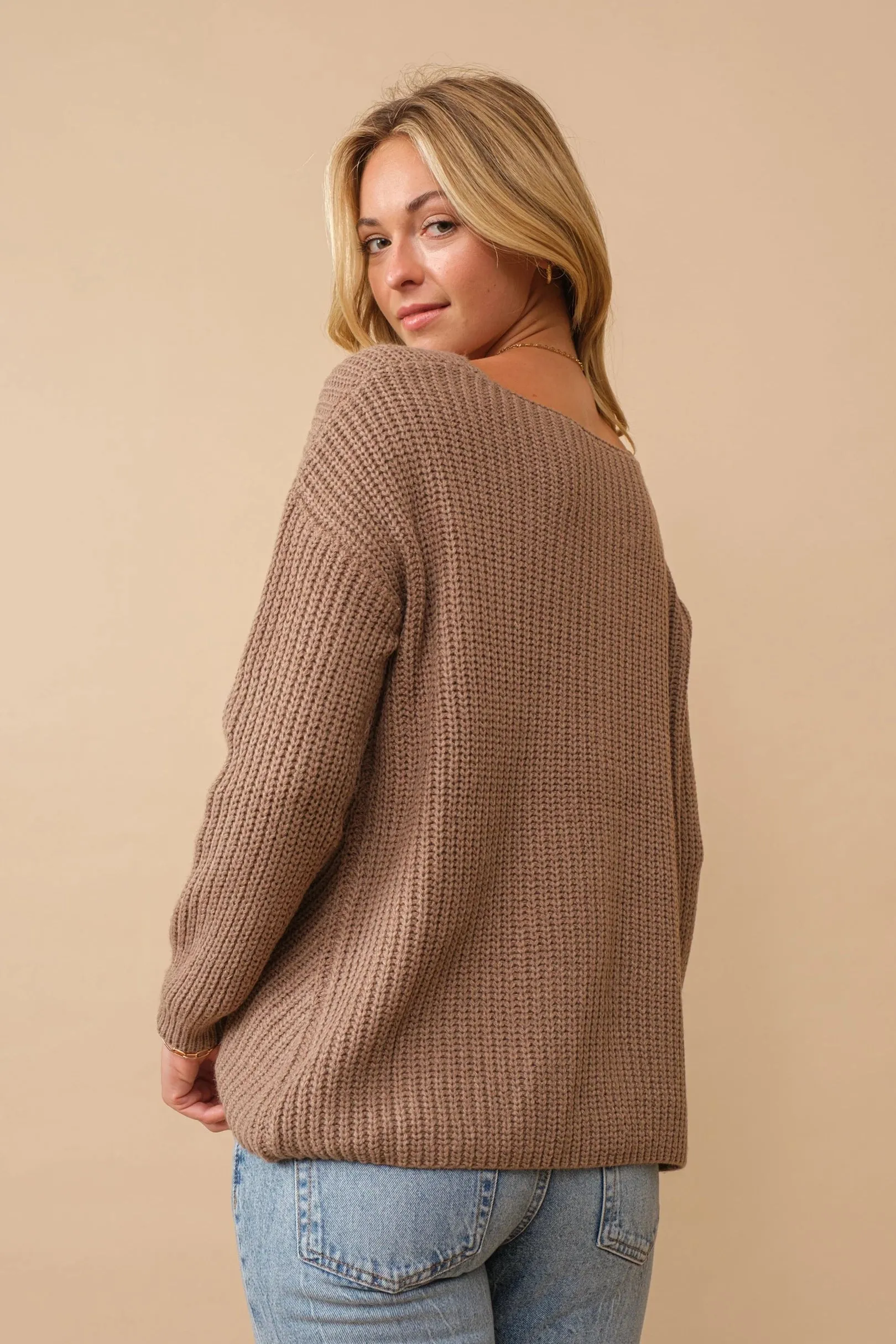 Ribbed knit round neck sweater with center lace-up detail